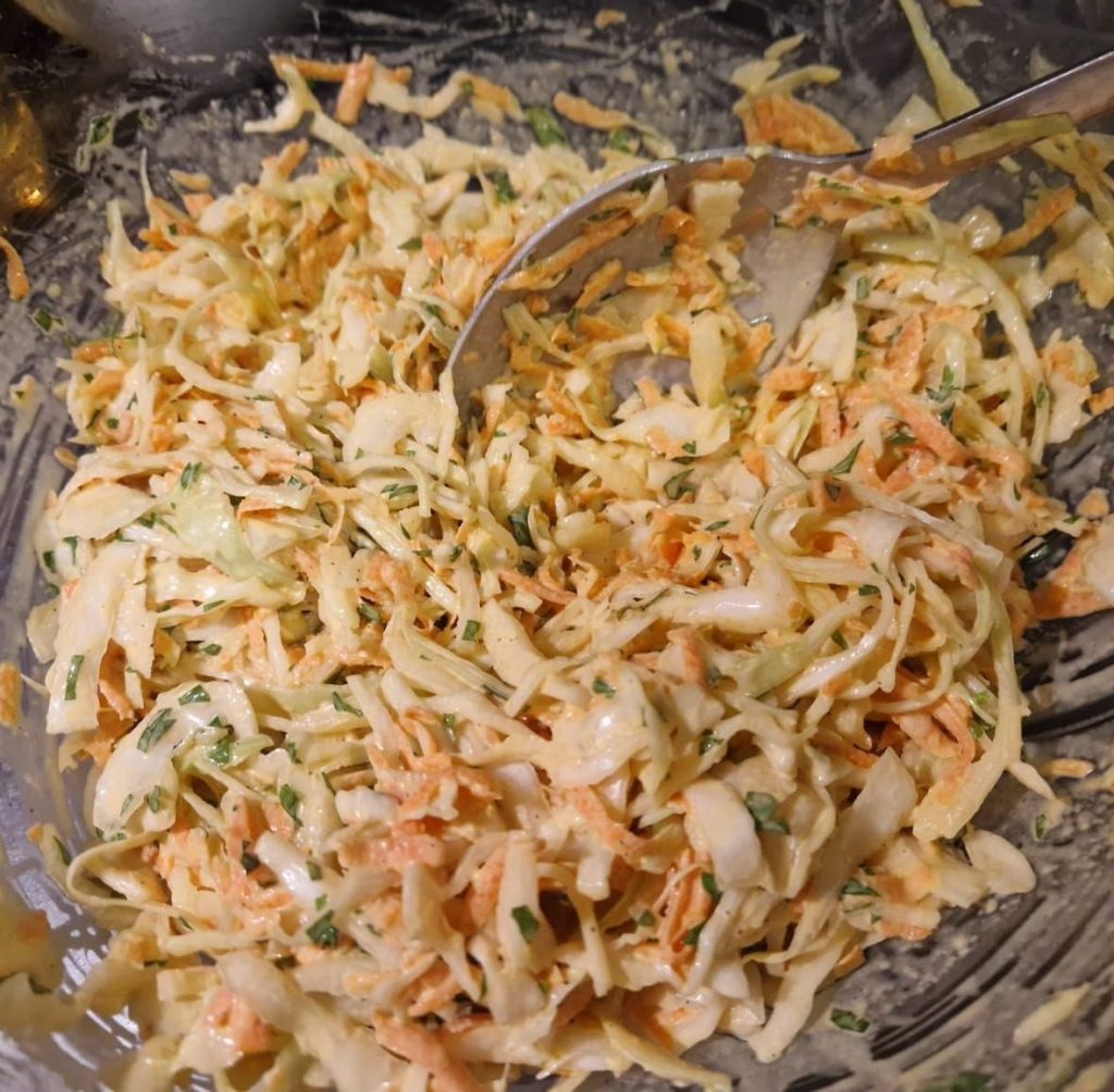 Coleslaw salad mixed in a bowl