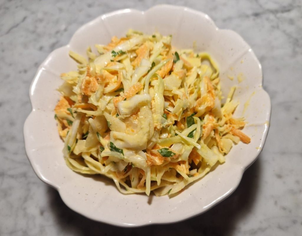 a plate with coleslaw dish